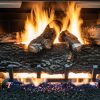 Cozy fireplace with burning logs and vibrant flames creating a warm, inviting ambiance.