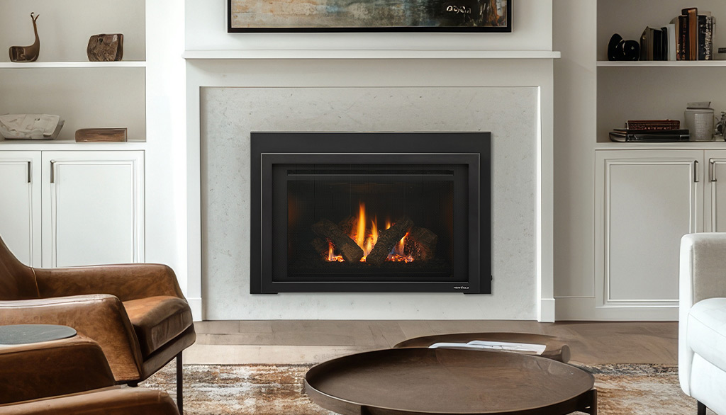Cozy living room with modern fireplace and leather chairs.
